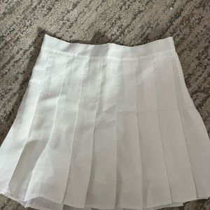 white pleaded skirt